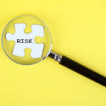 The word risk written on missing puzzle piece.