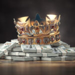 Gloden crown on a stack of hundreds of dollars. Business, investment financial concept.