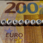 Inflation Concept Displayed With Letter Beads on Currency Background