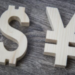 Exchange rating. Yen, Dollar on wooden wall