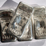 Four cast silver bars weighing 250 grams each.