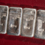 Four cast silver bars weighing 250 grams each