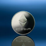 Close-up photo of ethereum silver coin (ETH).