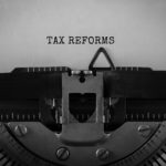Text Tax Reforms typed on retro typewriter